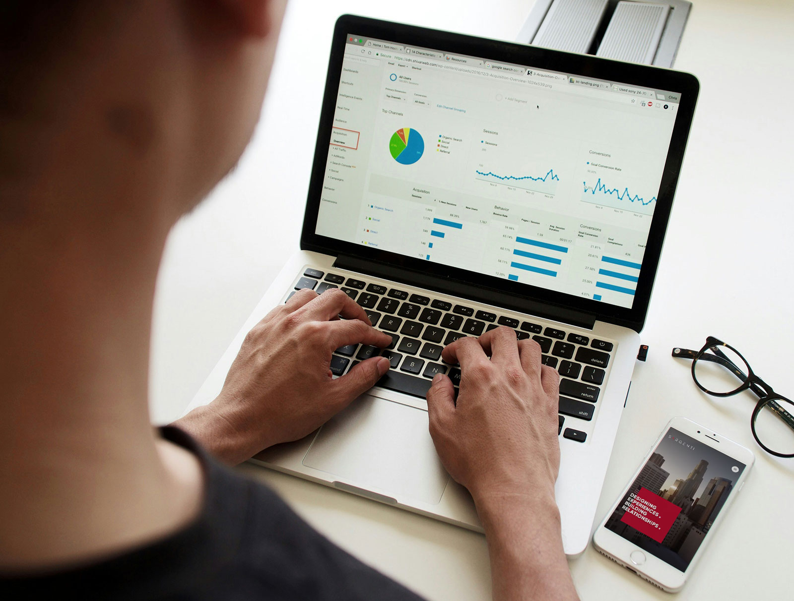 Man working at a computer on marketing campaigns in the AEC industry.