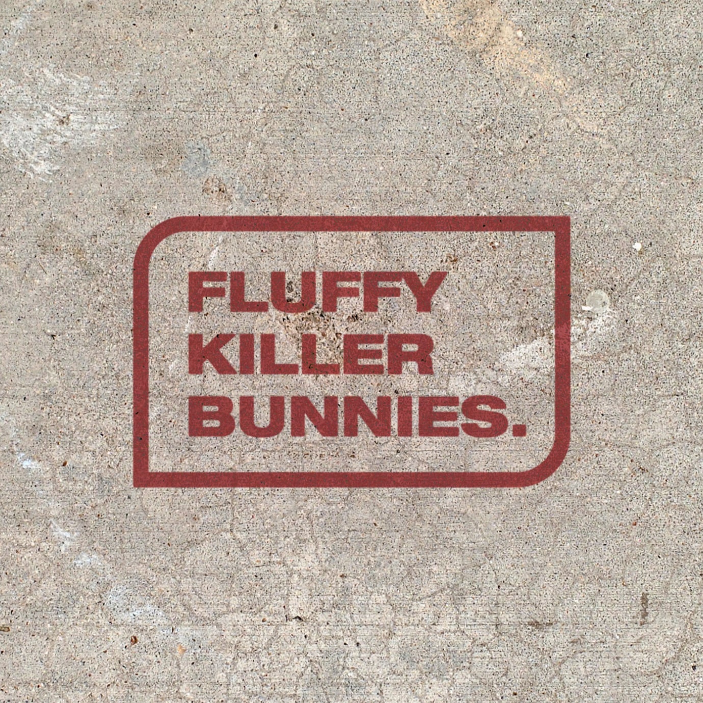 Concrete with red paint over it reading Fluffy Killer Bunnies for FKB's architecture firm branding.