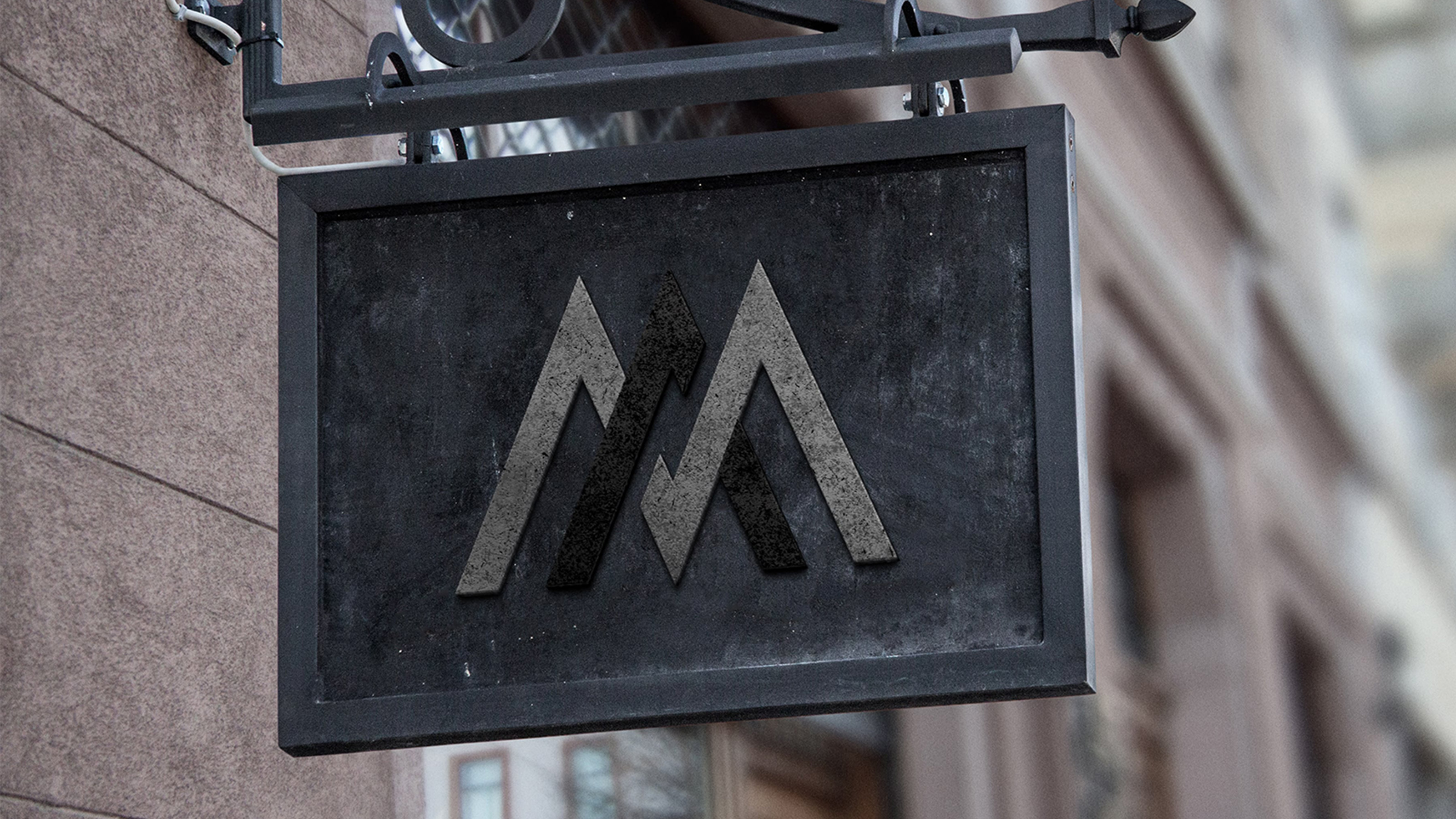 Mockup of Millan Architects Logo design by Third & Arch on metal outdoor sign.