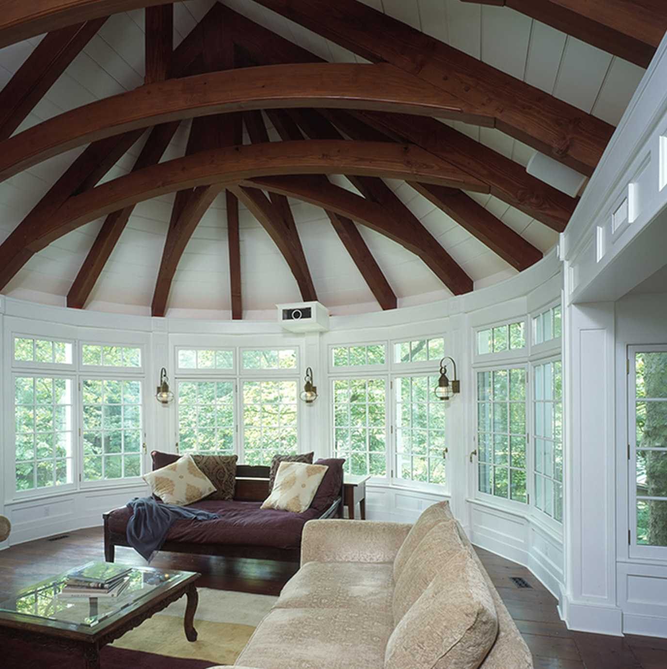 Millan Architects home design of a cozy living room featuring a comfortable couch and a stylish coffee table.