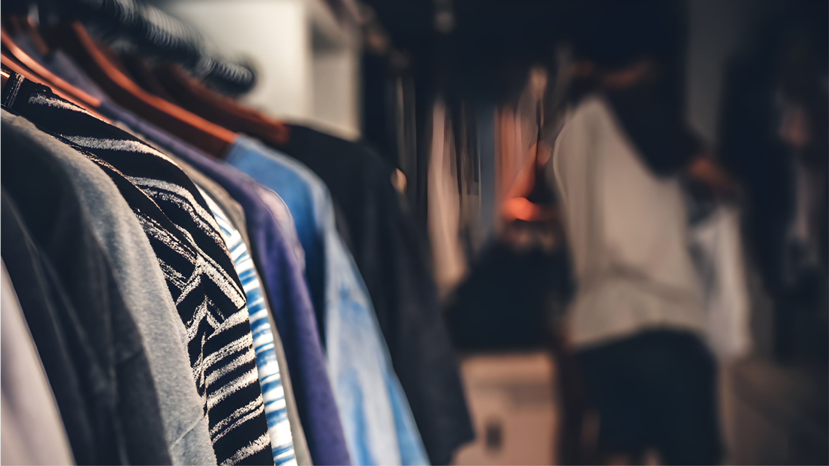 A line of t-shirts on a clothes rack rack for Sargenti architecture website design elements.