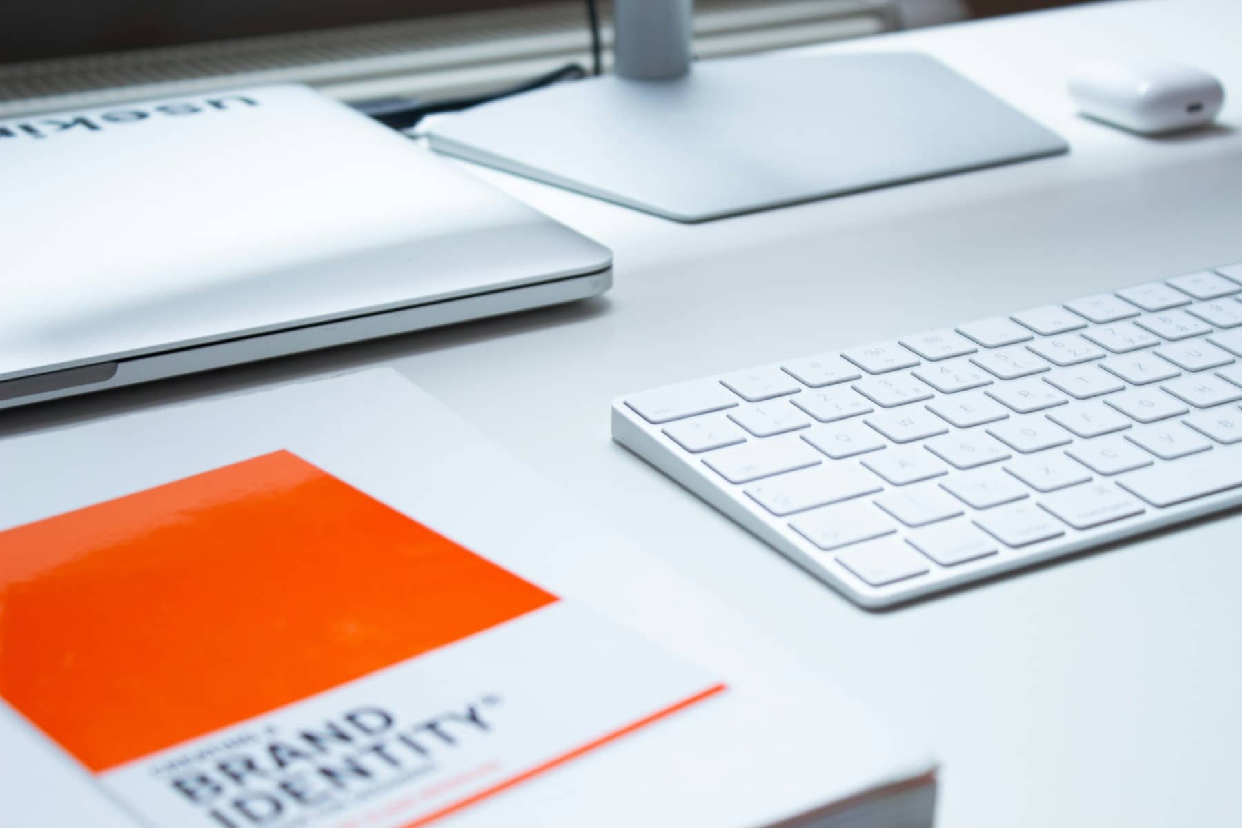 Third and Arch Designer's desk with strategic branding notebook titled Brand Identity.