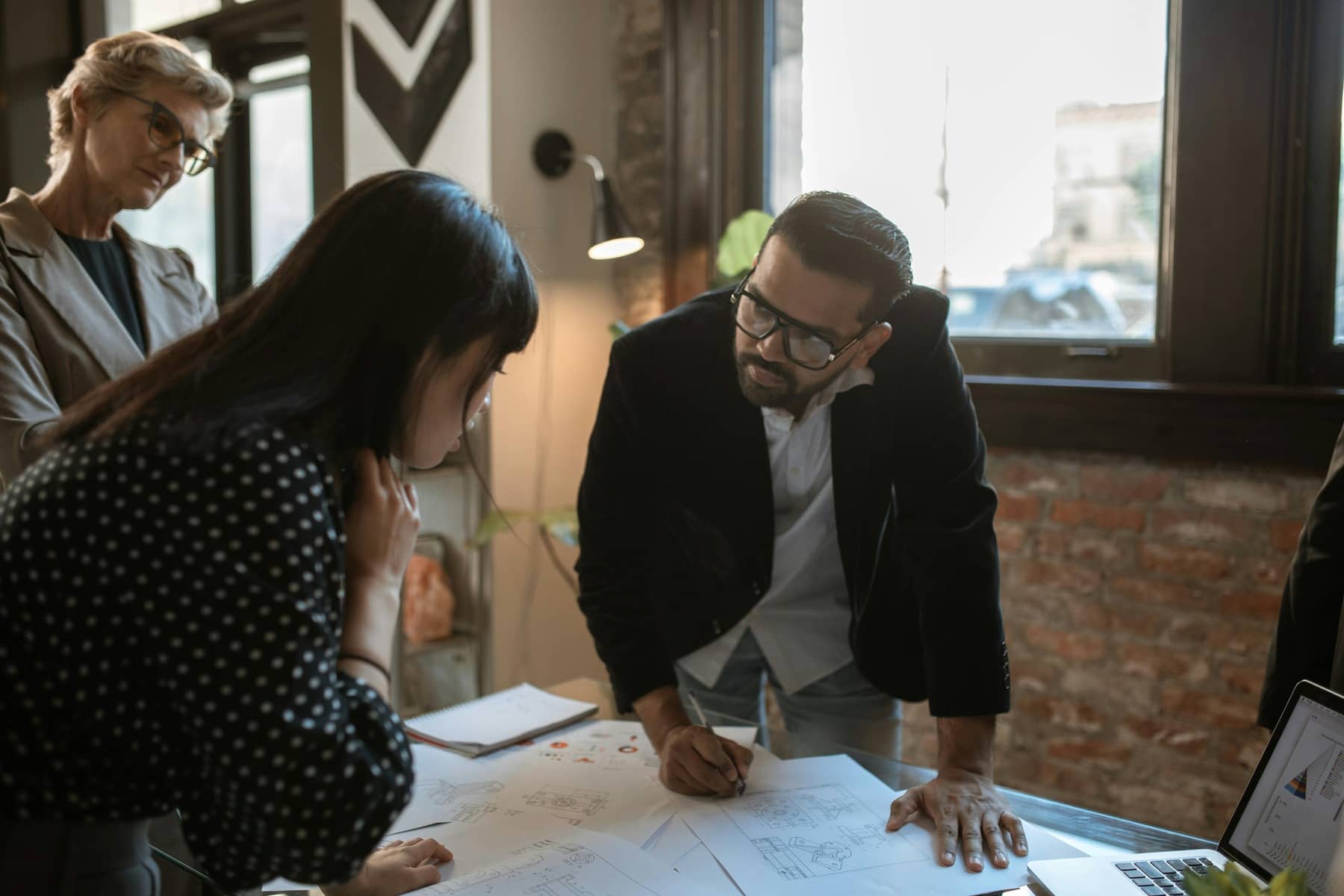 Architecture Firm team discussing marketing at office